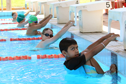 Students lining up for backstroke race