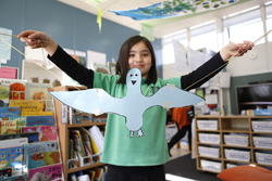 Student with bird puppet