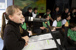 Student speaking at assembly